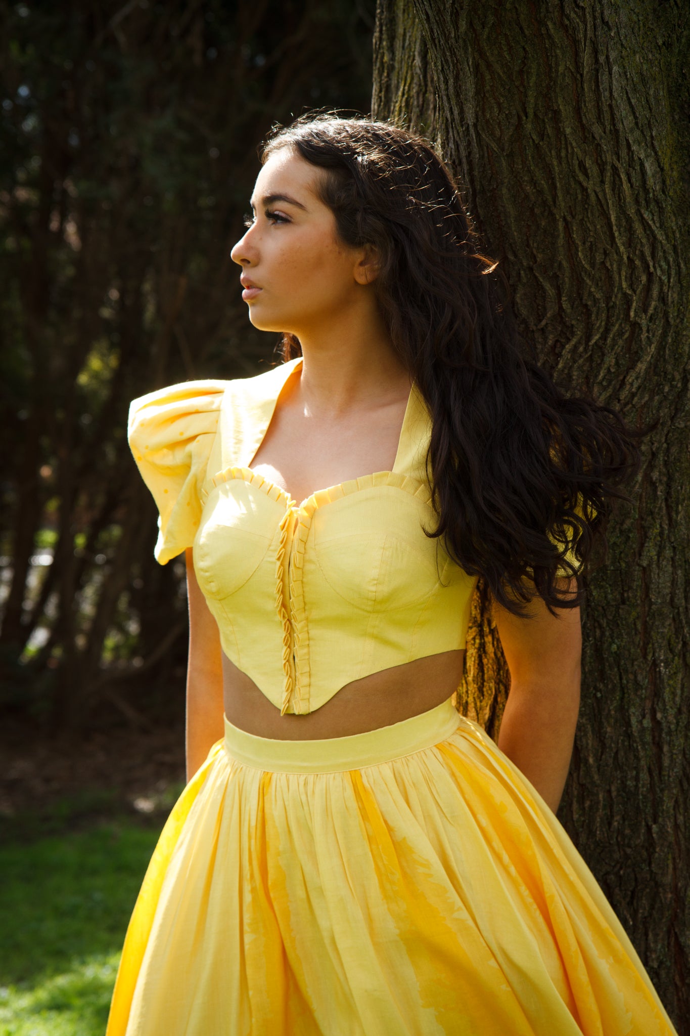 PRODUCT DESCRIPTION Premium silk cotton linen, Daffodil-Yellow unique 2-piece midi dress with short puff sleeves exclusive to MAZASHIE. Sweetheart neck, crop top with shirred back and bra-cut detail. Placement prints on the voluminous skirt and polka-dotted puff sleeves. The elasticated skirt waistband makes a perfect fit. The shirred back band makes a perfect fit. Invisible back zip closure at skirt. Side seam concealed pockets. Hooks and eyes closure at front.