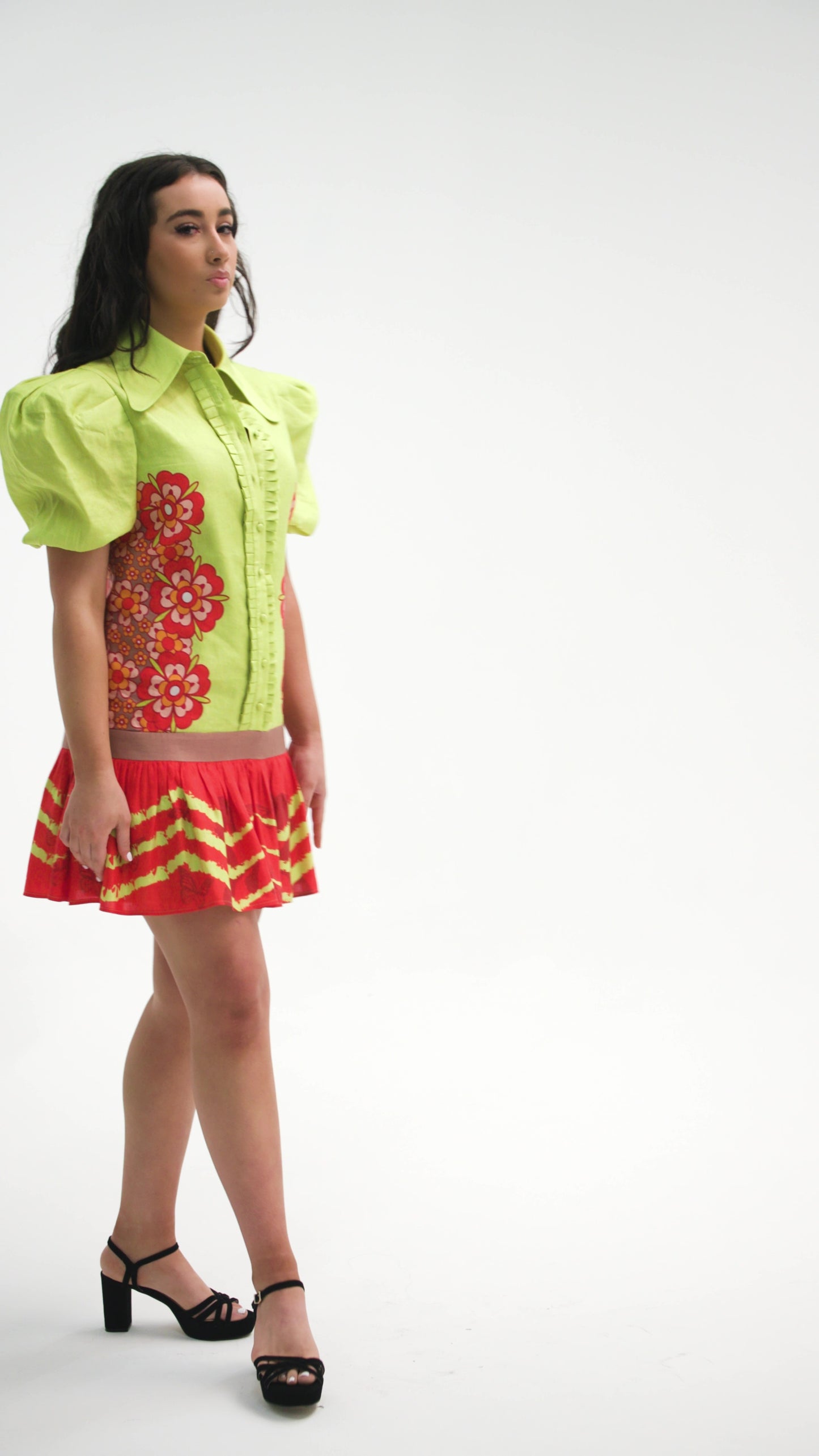 PRODUCT DESCRIPTION 105  Premium silk cotton linen, unique colour block mini dress with short puff sleeves exclusive to MAZASHIE.  Contrast the colour mini dress with Symmetrical Placement prints on the bodice and on the voluminous skirt ruffle.  Pleated placket ruffles add a luxurious look to the dress.  This dress is a loose fit with dropped waistline.  Self-covered button closure at front placket.  Fully lined in soft cotton
