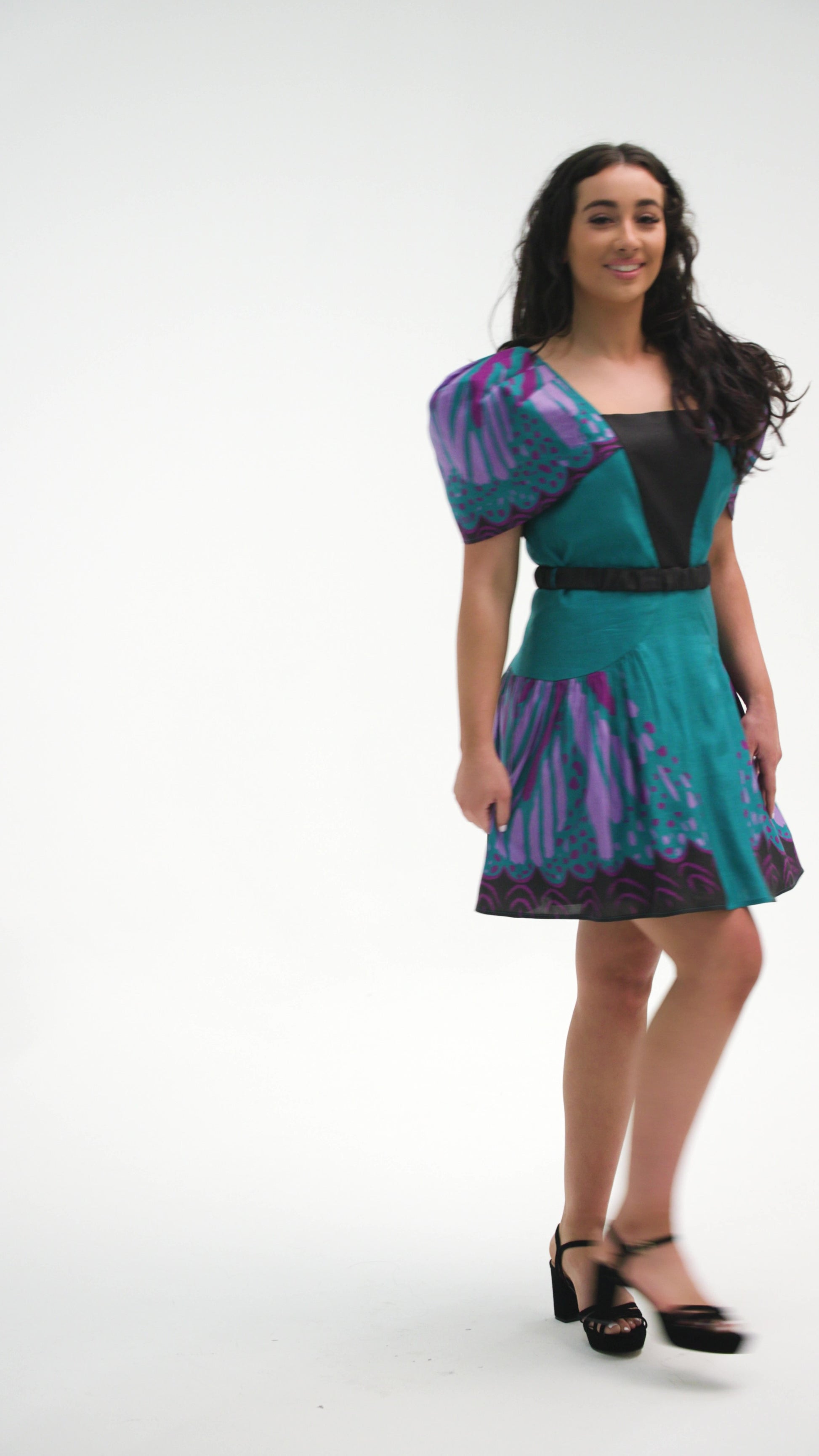 PRODUCT DESCRIPTION   Premium silk cotton linen, unique square neck mini dress with voluminous sleeves, exclusive to MAZASHIE.  Vibrant Placement print on sleeves and on the voluminous skirt.  Voluminous sleeves add a luxurious look to the dress.  Contrast front yoke.  The elasticated contrast waist belt makes a perfect fit.  Invisible back zip closure.  Shoulder retainers at each side of the shoulder to snaped through the bra straps to keep the dress in place.  Fully lined in soft cotton.   