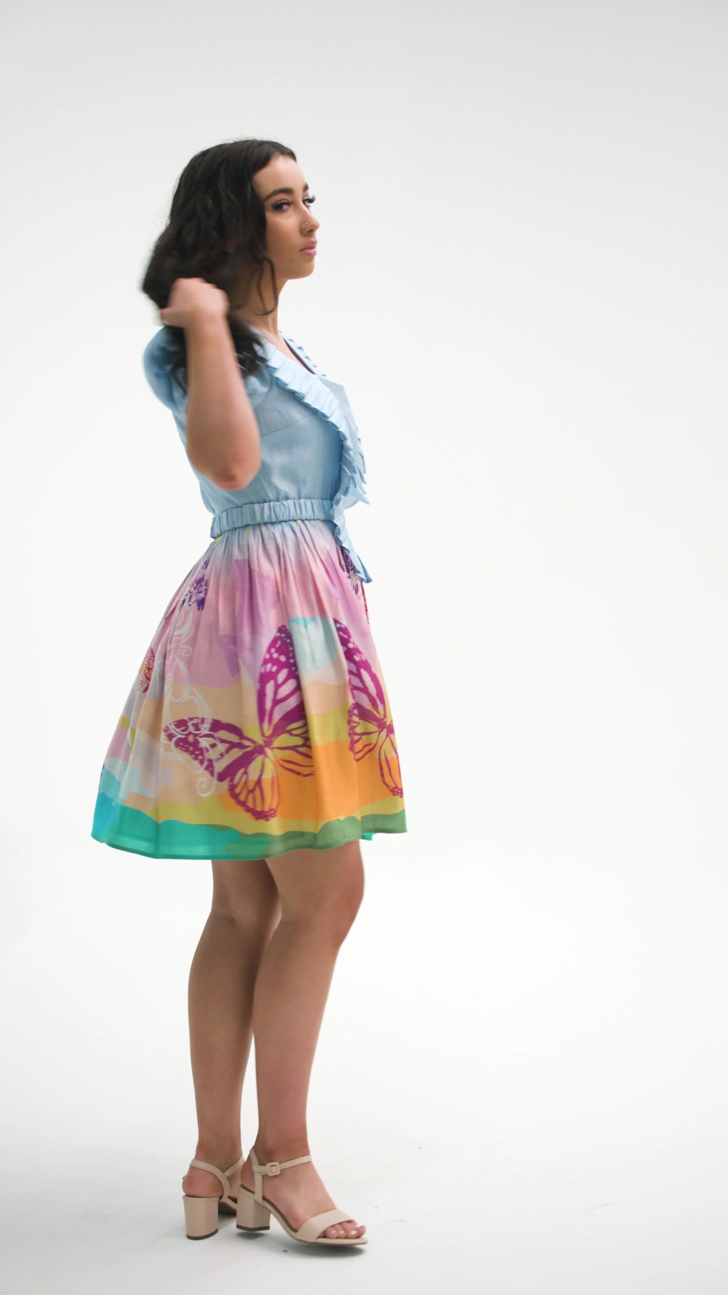 PRODUCT DESCRIPTION   Premium silk cotton linen, unique square neck mini dress with short puff sleeves exclusive to MAZASHIE.  Pastel colour mini dress with ‘magical dream story’ Placement prints on the voluminous skirt.  Pleated body ruffles add a luxurious look to the dress.  The elasticated self-fabric waist belt makes a perfect fit.  Invisible back zip closure.  Side seam concealed pockets.  Fully lined in soft cotton.