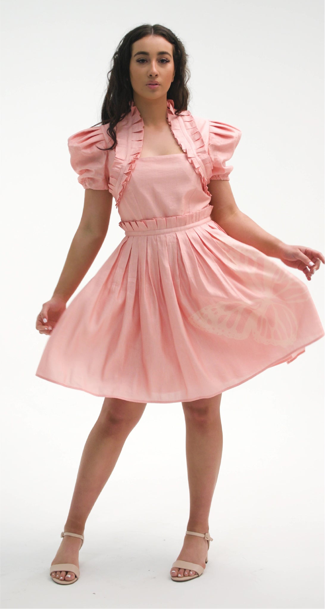 PRODUCT DESCRIPTION   Premium silk cotton linen, unique mini dress with short puff sleeves exclusive to MAZASHIE.  Pastel colour mini dress with Asymmetrical Placement prints on the voluminous skirt.  Pleated neck ruffles add a luxurious look to the dress.  Pleated paper bag detail at skirt waist.  Princess seams make a perfect fit.  The elasticated waist makes a perfect fit.  Invisible back zip closure.